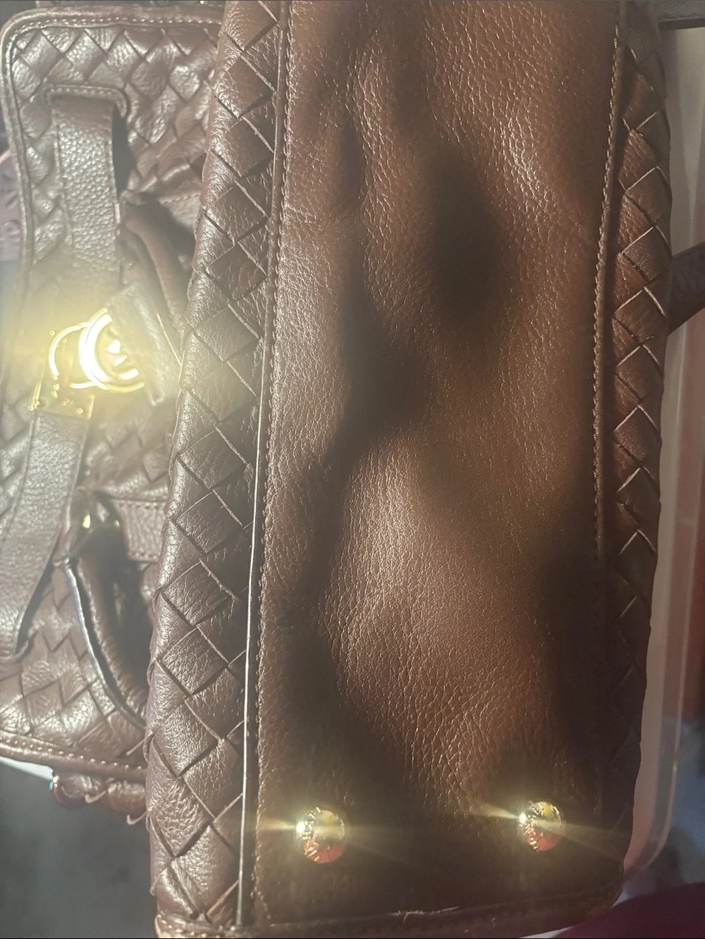 Michael Kors brown leather woven purse with lock and key